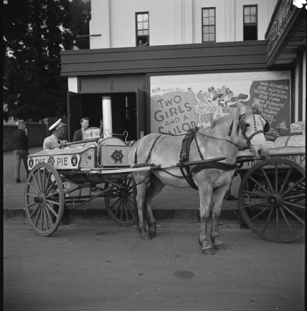 A two-wheeled pie cart outside the Empire Theatre in Toowoomba QLD in 1946