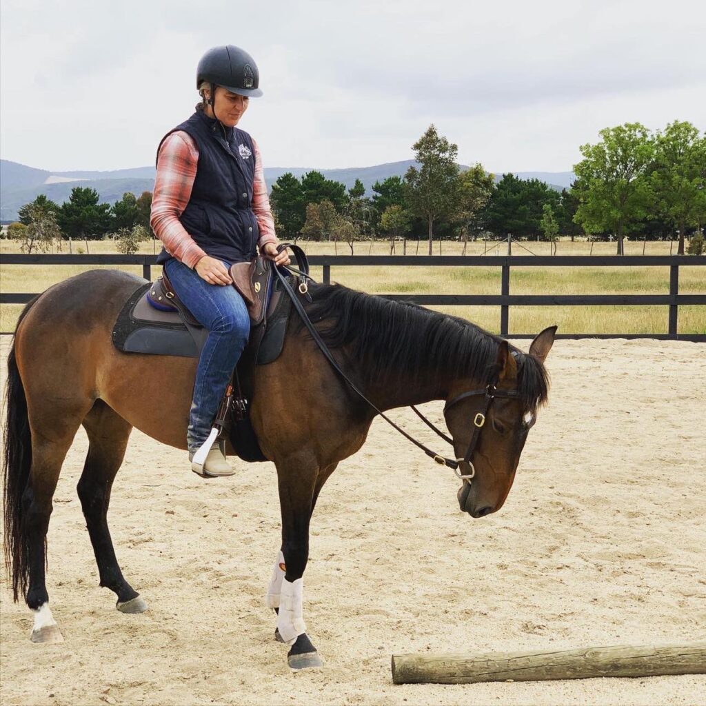 Waler mare Piperita and her owner Cate training at home