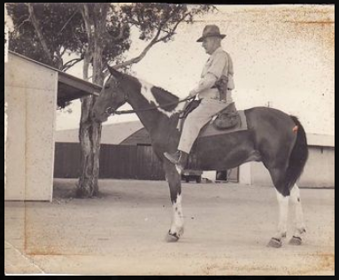 Charles Kenyon on his horse, patrolling between Whinstanes American army camp and Doomben Australian army camp, WW2