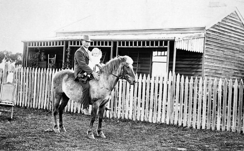 Man and child mounted on pony (looks to be Timor Pony) in Maffra Victoria 1916
