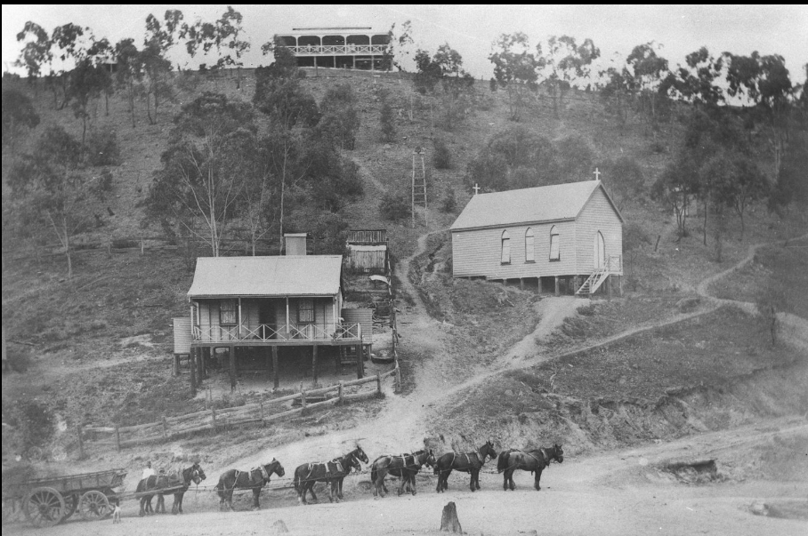 'View of houses, church and horse team on the road behind the Irvinebank tin mill, ca. 1906. Inscription on back of photograph reads: Road at the back of, and leading to, Irvinebank works.'
State Library Qld