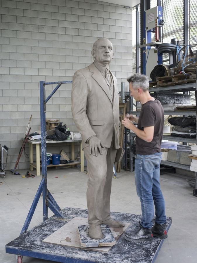 Sculptor Charles Robb working on a statue of Monash for the AWM.