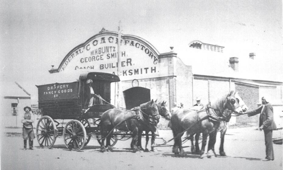 'Buntz - Federal Coach Factory, Wodonga. George Smith came to Wodonga c.1885 and carried on a business as a blacksmith and wheelwright in Hume Street. He subsequently erected the very substantial Federal Coach Factory in High Street. In 1901 the Coach Factory was sold to Mr C. E. Jones, but within three or four years George Smith again found himself in the establishment he had built. In 1907/8 Marcus Buntz partnered by a G. F. Simpson took possession of the Federal Coach Factory. In 1912 Buntz bought out the interest of Simpson and engaged a first-class wheelwright to do the woodwork. In 1912 a buggy could be had from £40 and a sulky £18. The business over many years developed from a shoeing forge and wheelwright business to a more modern day garage, keeping abreast with mechanisation. Marcus Buntz was joined in the business by his three sons, George, an A grade mechanic, Edward an auto-electrician and Henry, a blacksmith’s striker. The sons eventually took over the garage and handled both coach building and general service work....' Victorian Collections.