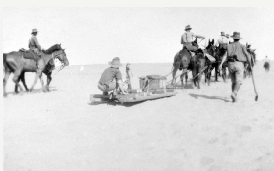'Sinai Deset, Palestine. 1916. Men of the 11th Light Horse regiment use a cable burying plough pulled by a team of horses to lay cable. Sinai, Egypt 1916.' AWM