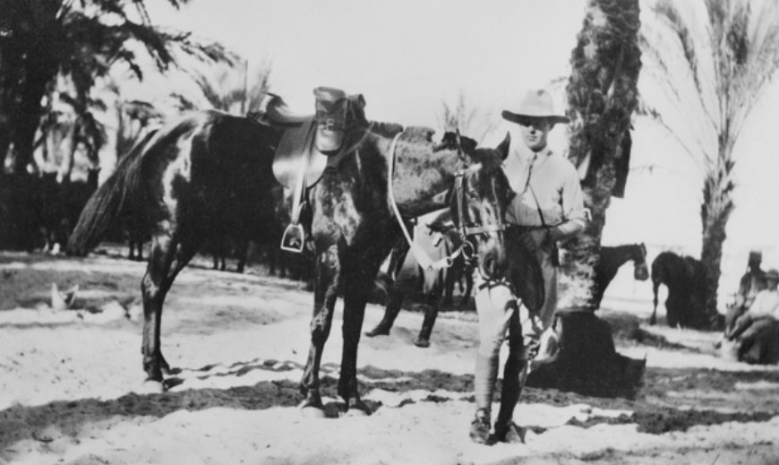'Egypt. Informal portrait of Captain (Capt) Eric Stanley Kater MC, 1st Light Horse Regiment, with his horse Toddy. He enlisted on 16 September 1914, served in Egypt and then returned to Australia on 16 February 1918. He was awarded the Military Cross (MC) for service at Tel el Khuweilfeh on 3 November 1917, "for conspicuous courage and devotion to duty on the 3rd November, 1917, at Khuweilfeh, in that he by his coolness, discretion and example held onto a forward position with his Squadron, although surrounded on three sides by machine and rifle fire, and inflicted considerable casualties on the enemy".' AWM