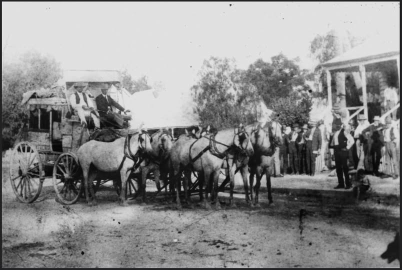 'Cobb & Co. coach arriving in St George, Queensland in 1910. The six-in-hand horse team pulling the Cobb & Co. coach as it arrives in St George. A large group of spectators has turned out to see the coach in front of the old St George post office. (Description supplied with photograph.) Actually a seven horse team.' State Library of Qld, via Flickr.