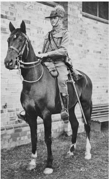 Informal portrait of Lieutenant E. Costello, 11th Light Horse, astride a horse at Moore Park. On 25 September 1918, Major Costello DSO, a squadron commander, led his men to victory in a hand to hand battle with the Turks and Germans at a railway station in Semakh. Moore Park, Sydney. 1914.' AWM