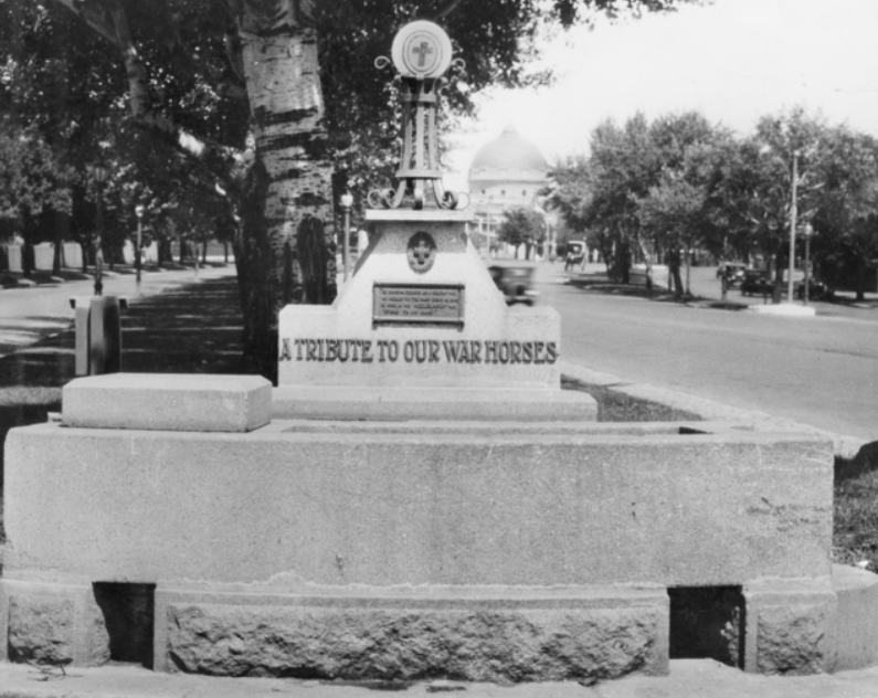 'A Memorial Drinking Trough, 1914-1918, erected in St Kilda Road, Melbourne by the Purple Cross Service of Victoria and unveiled on 10 May 1926 by Lieutenant General Sir John Monash GCMG KCB VD. Lines of verse on the tablet read: “He gains no crosses as a soldier may No medals for the many tasks he runs He only in his puzzled, patient way Sticks to his guns.” ' AWM (Australian War Memorial)