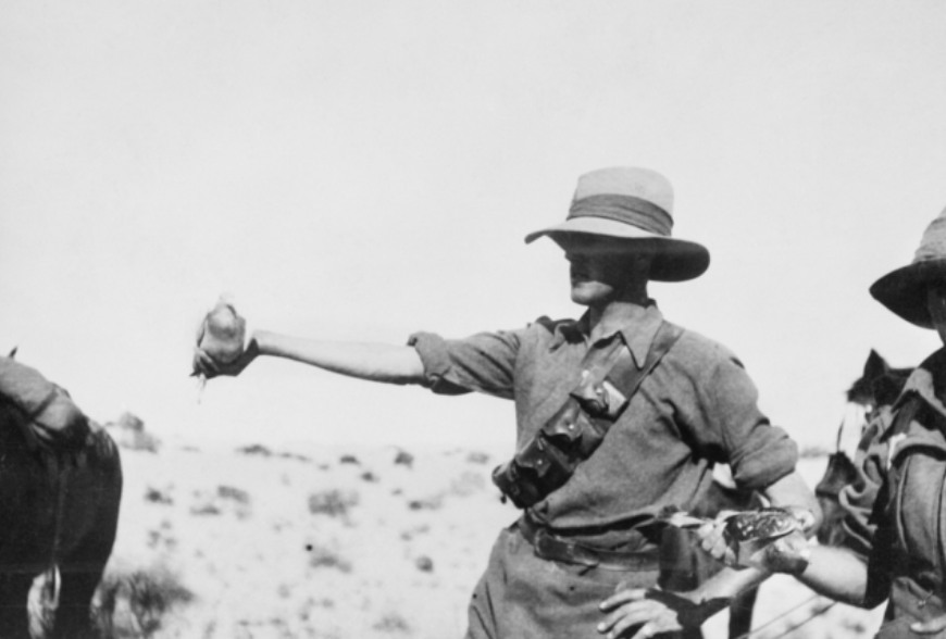 'An Australian Light Horse trooper about to release a carrier pigeon. Palestine 1915.' AWM